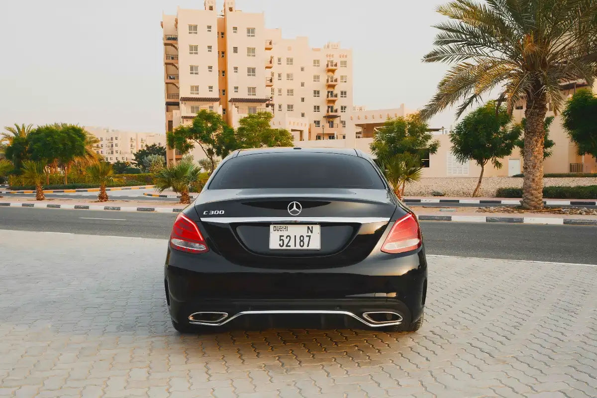 Sleek rear view of a Mercedes Benz C300, highlighting stylish design for Dubai luxury rentals.