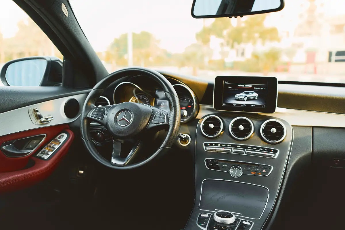 Mercedes Benz C300 in motion, showcasing performance for executive rental in Dubai.