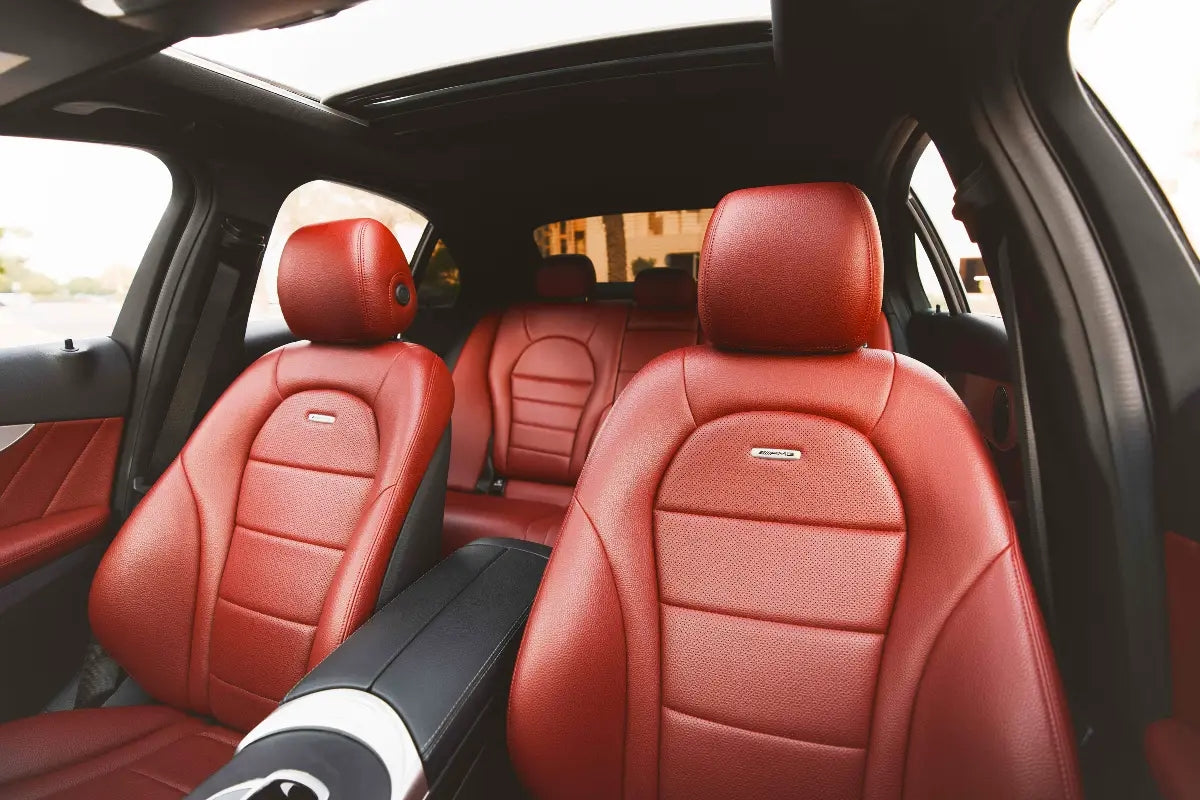 Mercedes Benz C300 dashboard and steering wheel, emphasizing high-end rental options in Dubai.