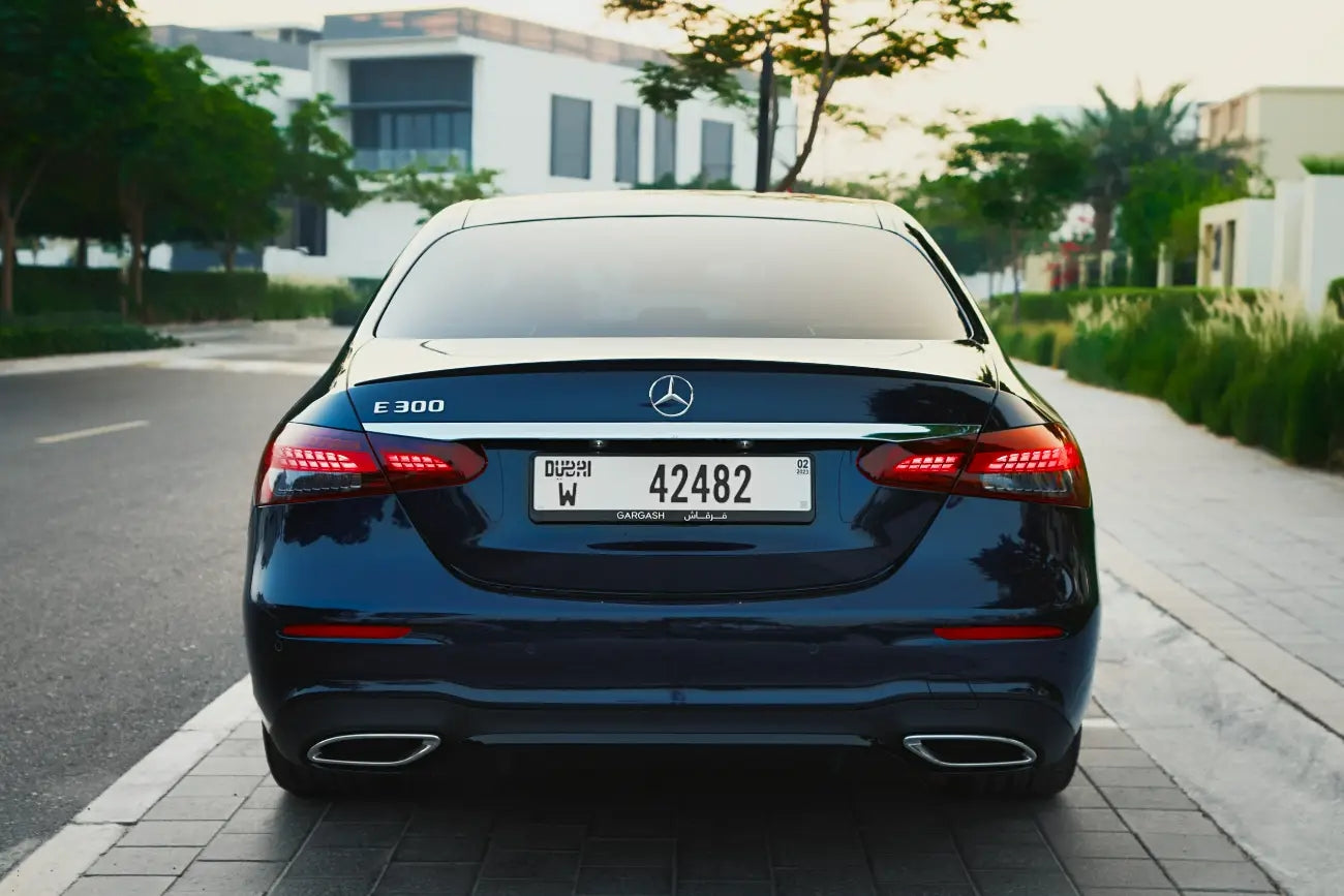 Side profile of the Mercedes-Benz E300 2022, highlighting sleek lines for executive sedan rentals in Dubai.