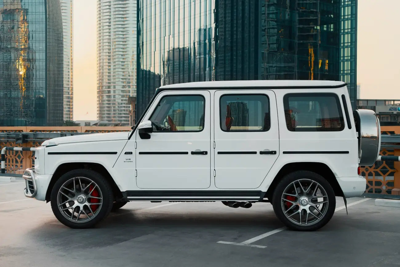 Front angle view of a Mercedes Benz G63 in Dubai, demonstrating its robust grille and LED headlights for luxury rentals.