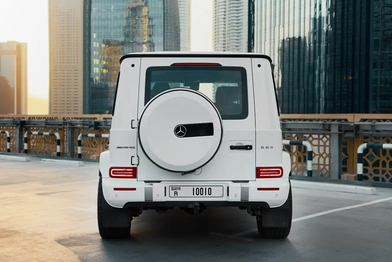 Side profile of a Mercedes Benz G63 for hire in Dubai, highlighting its unique alloy wheels and sophisticated lines.
