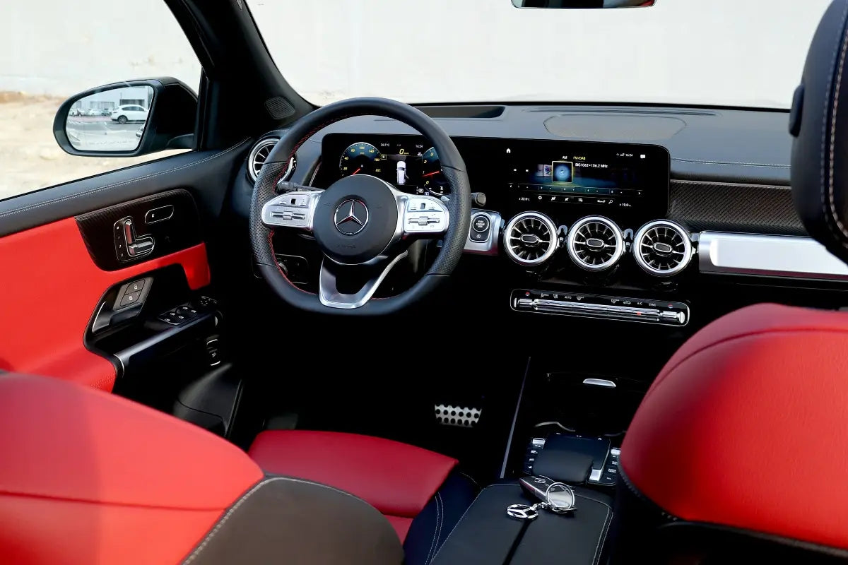 Close-up of the Mercedes Benz GLB 250's dashboard and steering wheel, featuring state-of-the-art technology for a superior driving experience in Dubai.