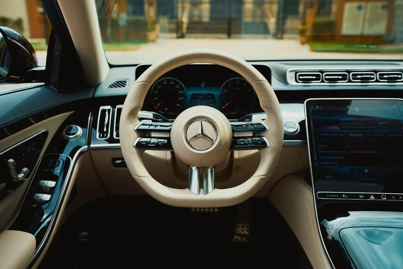 Rear view of a 2021 Mercedes-Benz S500 in silver, emphasizing its sophisticated design and dual exhausts - executive sedan rental in Dubai