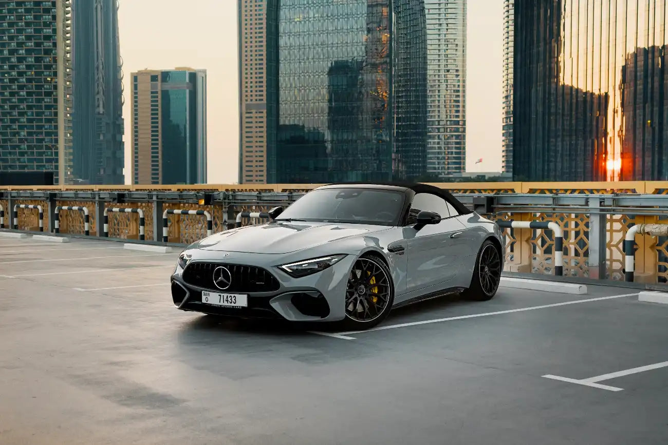 Luxury Mercedes-Benz SL63 AMG convertible for rent in Dubai, showcasing its sleek profile.