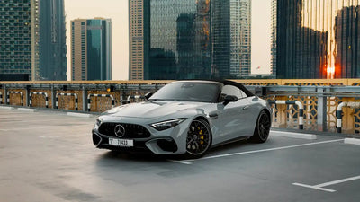 Luxury Mercedes-Benz SL63 AMG convertible for rent in Dubai, showcasing its sleek profile.