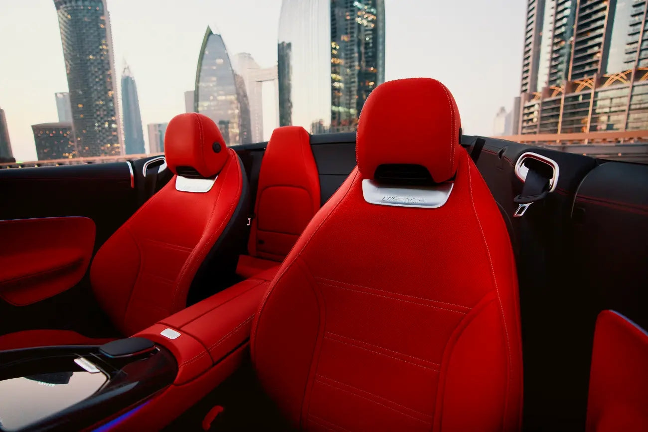 Mercedes-Benz SL63 AMG under the dazzling Dubai skyline, epitomizing top-tier convertible rental luxury.