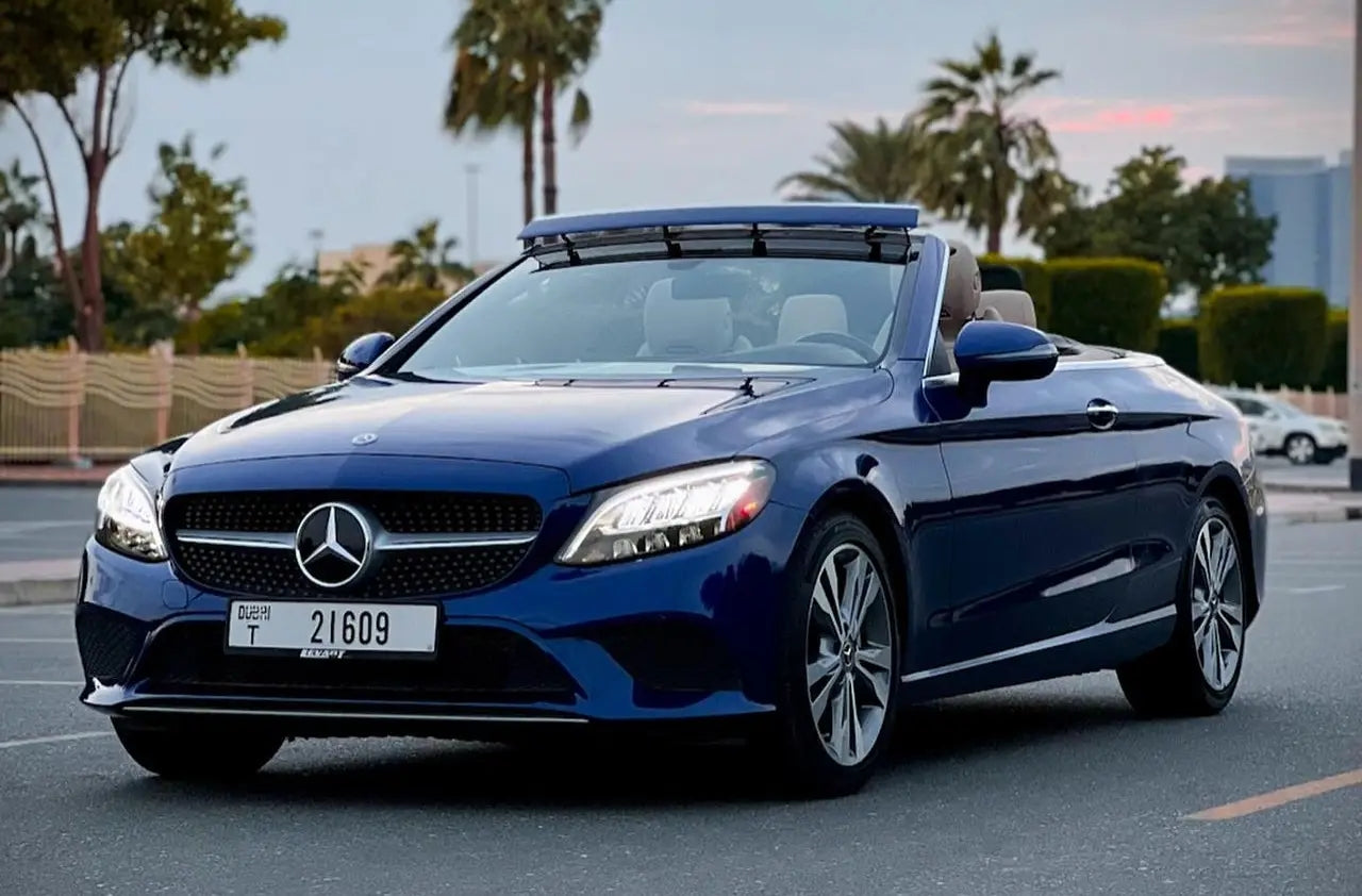 Sleek Mercedes C300 Convertible in stunning silver, perfect for luxury rental in Dubai.