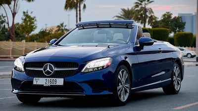 Sleek Mercedes C300 Convertible in stunning silver, perfect for luxury rental in Dubai.