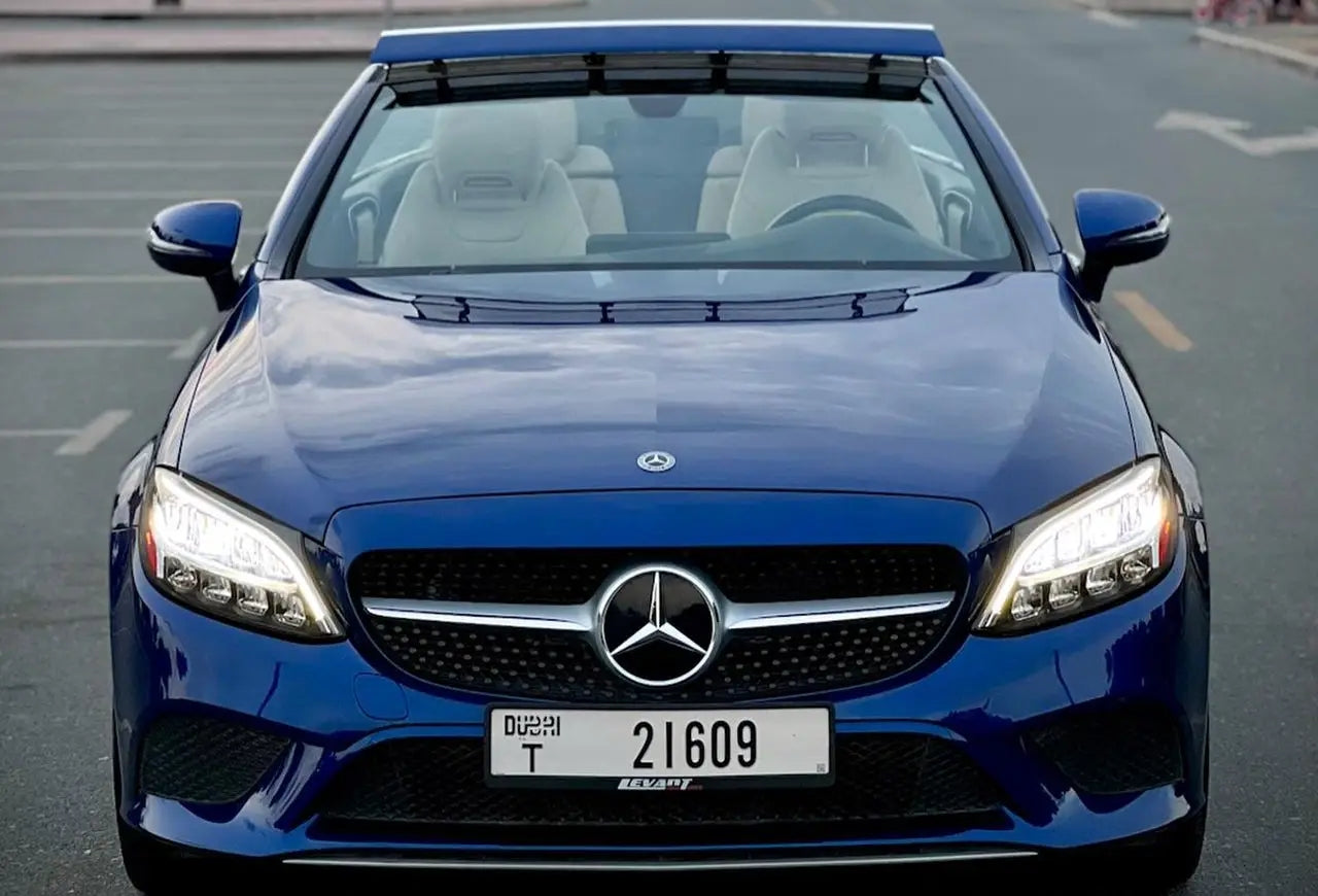 Luxury Mercedes C300 Convertible with top down, ready to rent and cruise Dubai's streets.