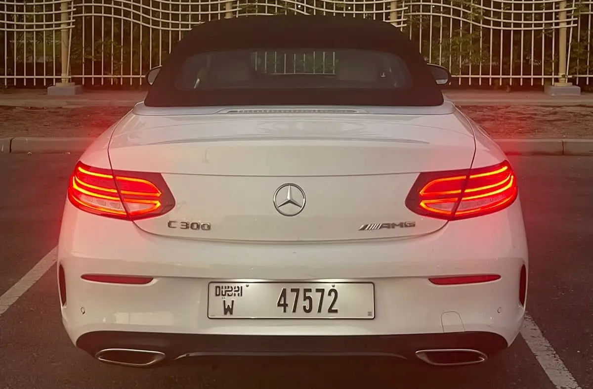 Front grille and emblem detail of a Mercedes C300 Convertible, epitomizing luxury car rental in Dubai.