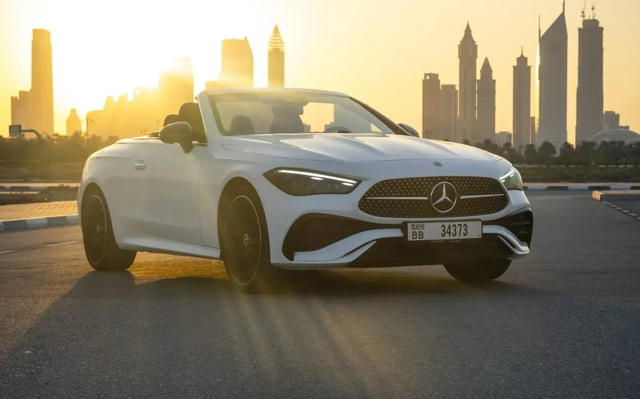 Sleek Mercedes CLE 200 luxury convertible cruising on Dubai streets, perfect for high-end rentals.