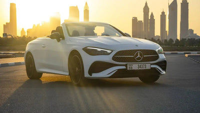 Sleek Mercedes CLE 200 luxury convertible cruising on Dubai streets, perfect for high-end rentals.