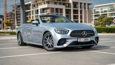 Sleek Mercedes E200 Cabrio luxury convertible for rent in Dubai, showcasing its elegant lines and design.