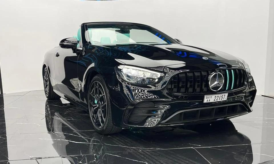 Luxurious black Mercedes E53 AMG executive sedan, front view, ready to rent in Dubai.