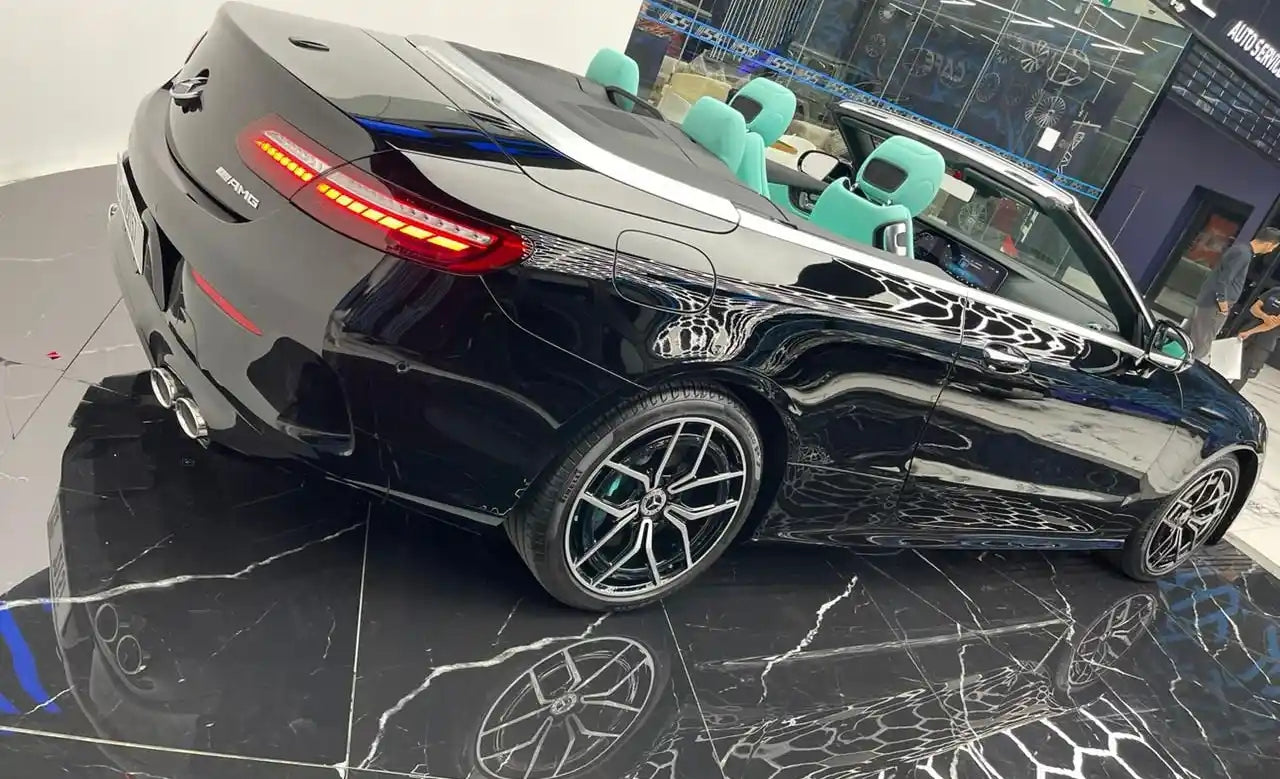 Rear angle of Mercedes E53 AMG executive rental sedan, emphasizing sporty design in Dubai.