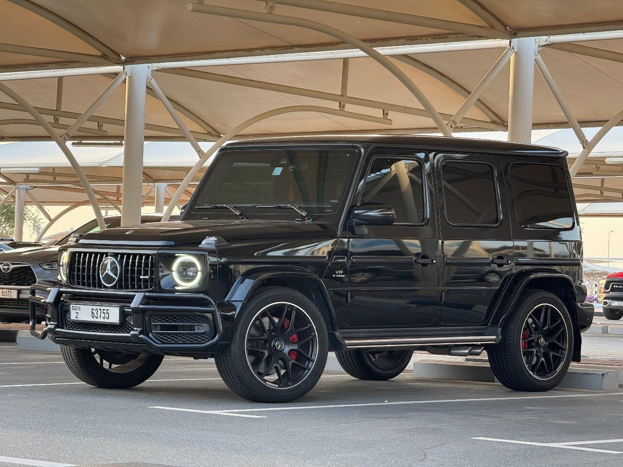 Mercedes G63 AMG cruising on Dubai streets - capture the essence of luxury and power in this SUV rental.