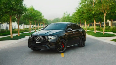 Front view of black 2022 Mercedes GLE 63 luxury SUV available for rent in Dubai, showcasing its sleek design and powerful stance.