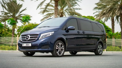 Luxurious silver Mercedes V250 van parked in Dubai, perfect for upscale group travel rentals.