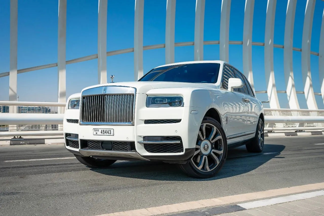 Rolls Royce Cullinan luxury SUV in elegant black, available for rent in Dubai, showcasing its majestic front grille and iconic Spirit of Ecstasy.