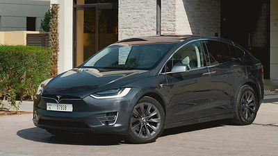 Sleek Tesla Model X luxury SUV available for rent in Dubai, showcasing its futuristic design.