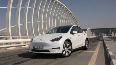 Gleaming Tesla Model Y Long Range, luxury SUV side view, available for rent in Dubai.
