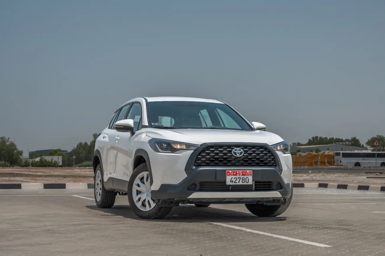 Front view of a sleek Toyota Corolla Cross, the ideal economy SUV for rent in Dubai, showcasing its modern design.