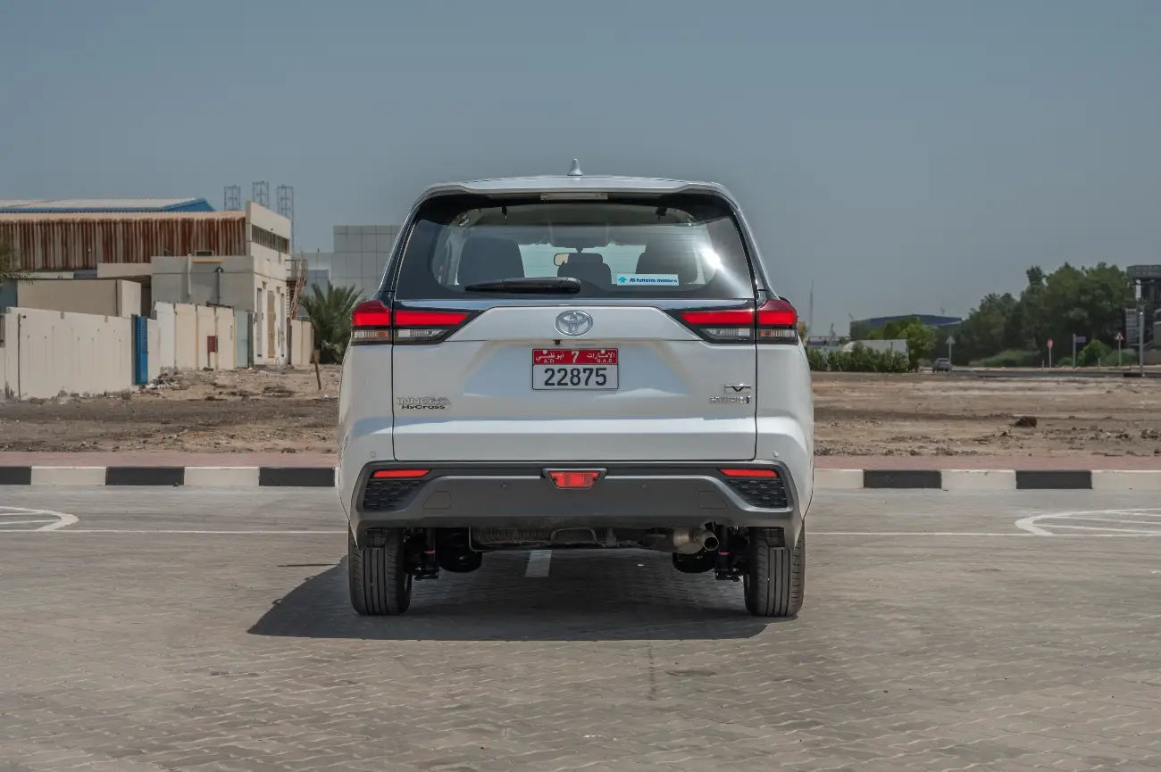 Front grille and headlights detail on Toyota Innova Hybrid, luxury van for rent in Dubai
