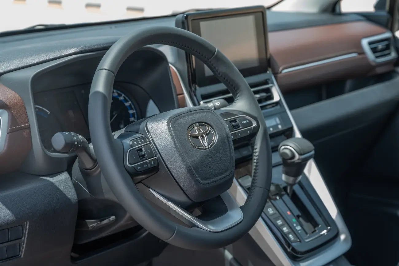 Rear angle of Toyota Innova Hybrid, highlighting spacious cargo area for Dubai vacations